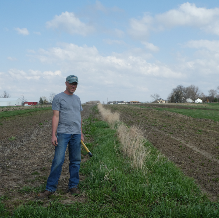 Photo of Andy Dunham in a crop field.